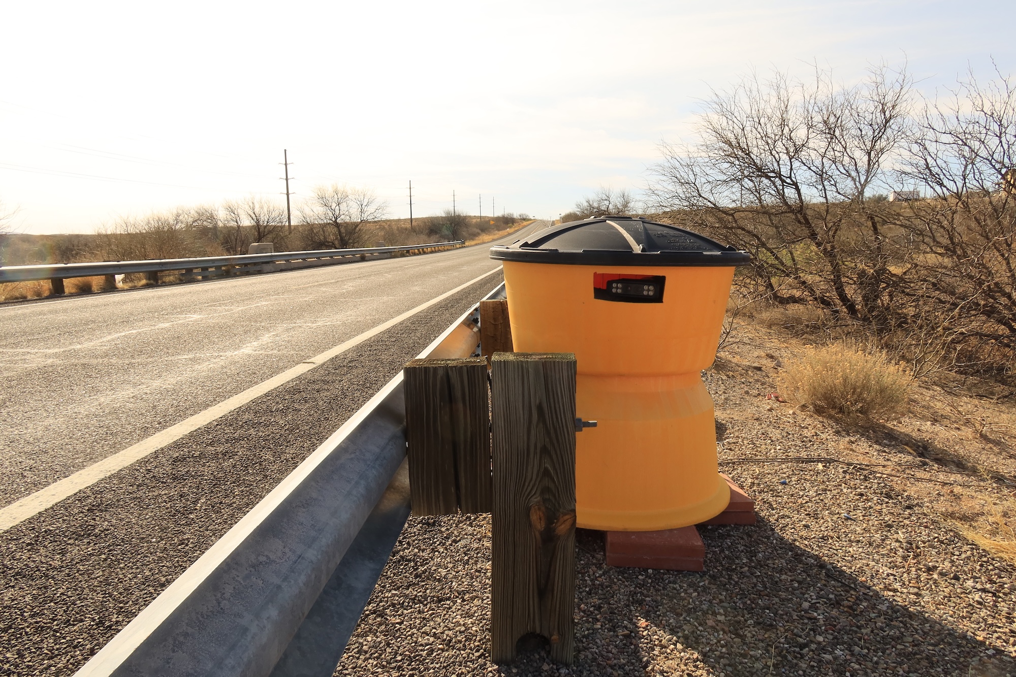 A camera hidden in a yellow sand barrel. A camera hidden in a yellow sand barrel.
