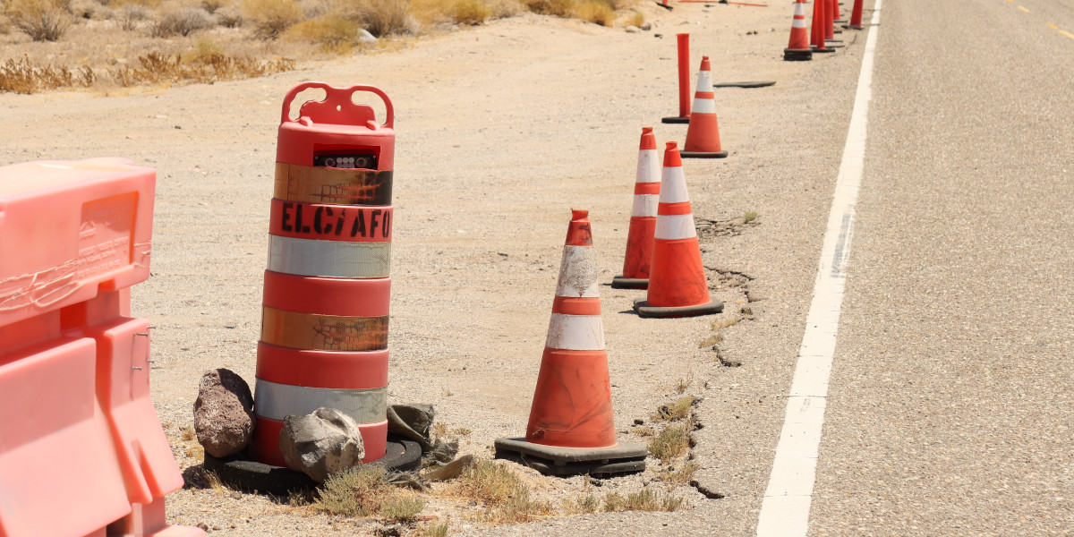 An ALPR in a traffic barrel by the road