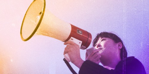 woman speaking into bullhorn, vintage photo style