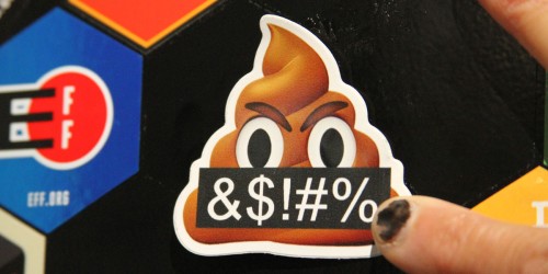 Sticker of an angry poop emoji, black banner reads "&$!#%"