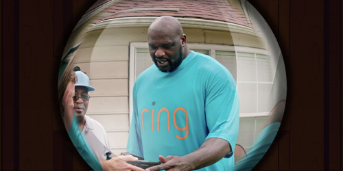 Shaq endorsing Ring with some people, as viewed through a peephole
