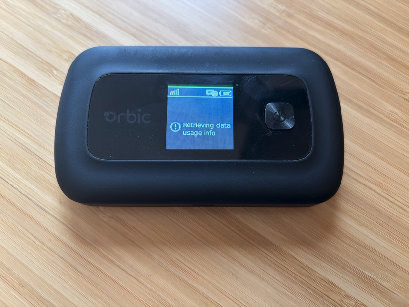 A picture of Rayhunter running on the orbic hotspot. Orbic is about the size of a small cell phone and the rayhunter UI is a single green line at the top A picture of Rayhunter running on the orbic hotspot. Orbic is about the size of a small cell phone and the rayhunter UI is a single green line at the top